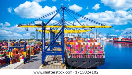 Container ship at industrial port in import export global business worldwide logistic and transportation, Container ship unloading freight shipping, Container cargo industry vessel boat freight.