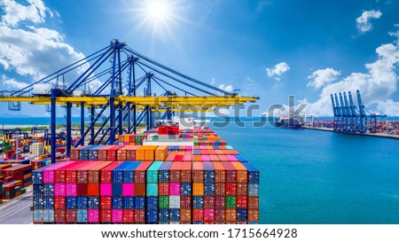 Container ship unloading in deep sea port, Global industry business logistic import export freight shipping transportation oversea worldwide by container ship, Container vessel loading cargo freight.