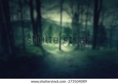 Creepy and scary background with house in the middle of dark forest for web usage