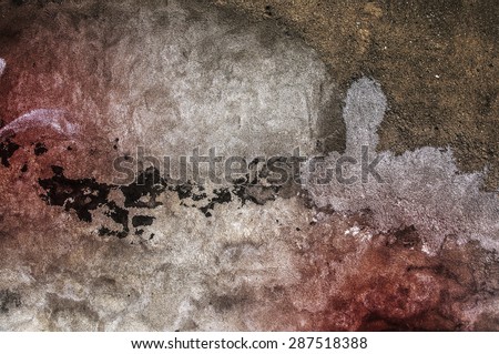Grunge background of colorful damaged wall. Colors: white, brown, black and brown
