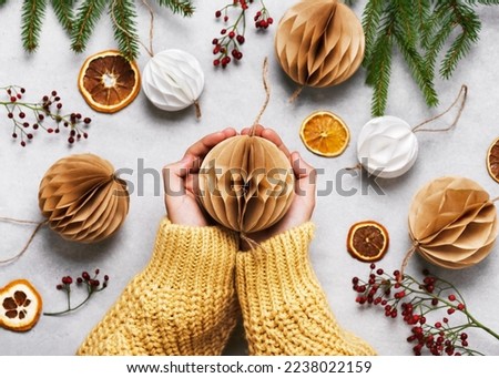 Similar – Image, Stock Photo Christmas tree decorations made of glass in the shape of a star hang in the Christmas tree. In the background you see blurredly even more tree decorations
