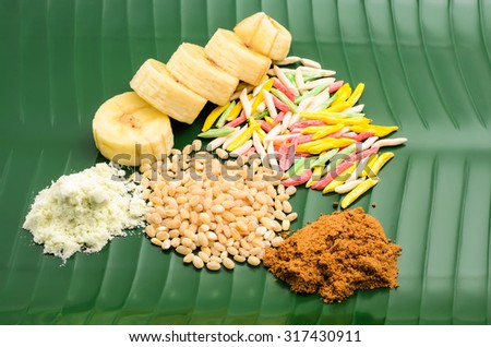 Raw ingredients for sweet Cha-cha porridge on green banana leaf plate
