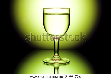 wine glasses in backlight on the black and yellow contrast background