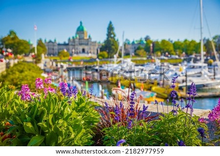 Victoria, British Columbia, Canada-blurred photo. Victoria Harbour and Parliament Buildings at sunny summer day. Inner Harbour, Popular tourist destination with eco-tours, unique shops-July 19,2022 ストックフォト © 