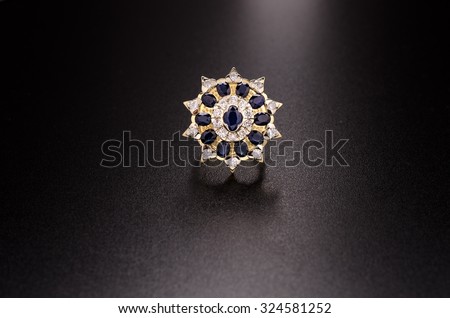 yellow gold diamond ring with sapphires isolated on white background