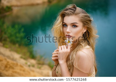 Similar – Image, Stock Photo A gorgeous girl with white flowers in her mouth and covered in pink stuff is flirting with a camera. Her sexy curves are undeniable. A wild model test in a toilet.