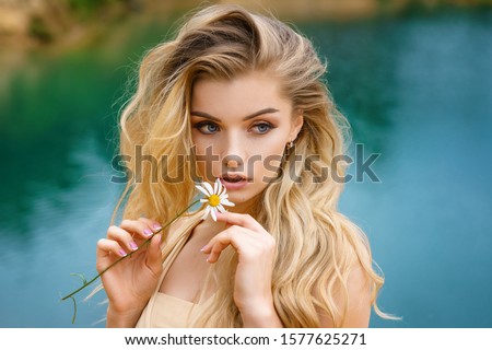 Similar – Image, Stock Photo A gorgeous girl with white flowers in her mouth and covered in pink stuff is flirting with a camera. Her sexy curves are undeniable. A wild model test in a toilet.