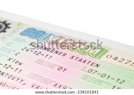 German Schengen visa in travel passport closeup with white copy space background