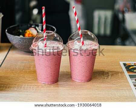 Similar – Image, Stock Photo two plastic cups with liquor stand on a wooden table