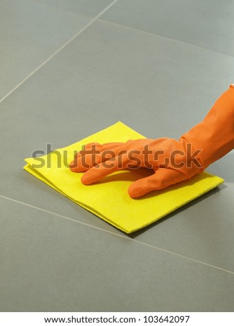 Floor polishing equipment: glove and rubber, closeup