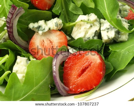 Salad with summer fruits and fresh vegetables, closeup