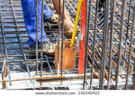 Making a construction with a metal rods, closeup