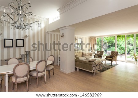 Vintage mansion - an elegant beige interior with a living and a dining room