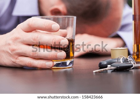 Alcoholic sleeping on the table with car keys