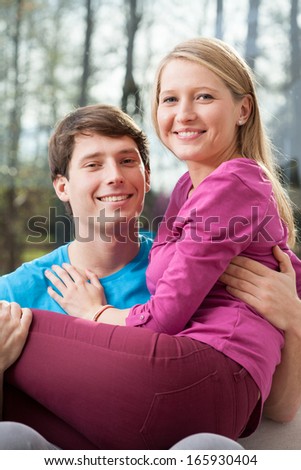 Young married couple spending the first moments in a new home