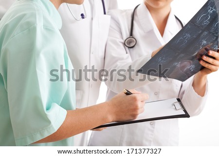 Physician determining medical treatment for emergency patient