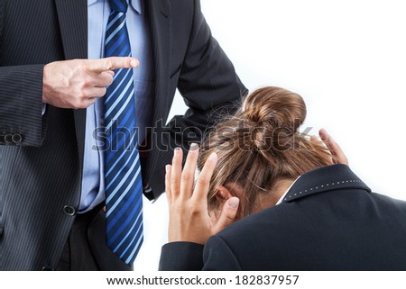 Boss putting his finger in front of an employee to bully her