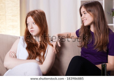 Two friend on a couch during quarrel