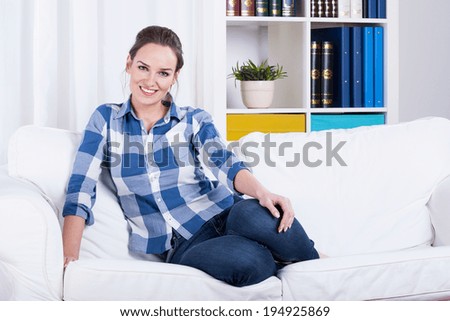 Woman resting on a couch at home