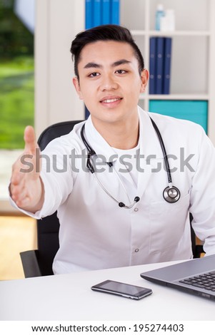 Vertical view of an asian doctor during welcome