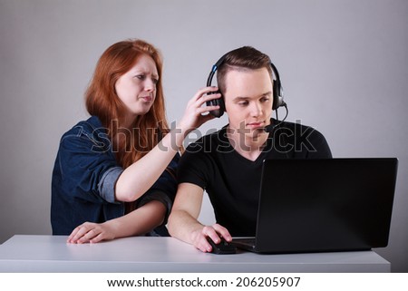 Young girl is angry for her computer addicted boyfriend