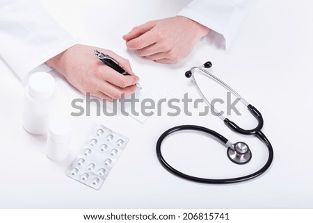 Doctor prescribing medicines to patient closeup frame