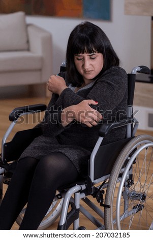 Sad and alone woman on a wheelchair