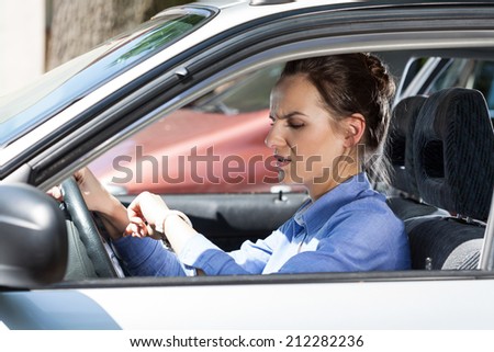 Woman late for work in a car