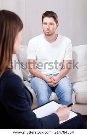 Young psychotic depressed man on psychiatric visit