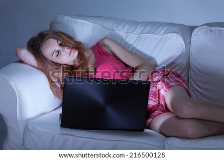 Girl sleeping on couch with her computer