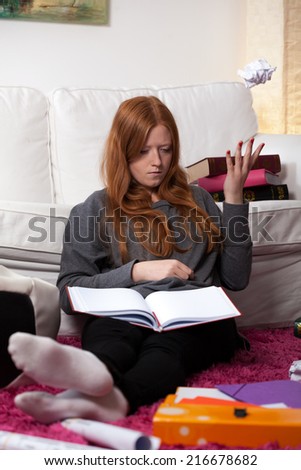 View of young woman learning before exam