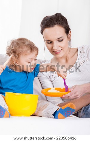 Portrait of mom and son playing together