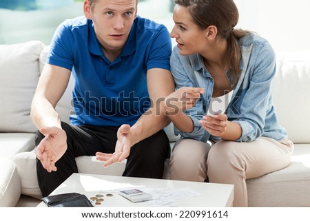 Young marriage having bills to pay, horizontal