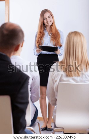Young clever woman presenting her ideas during recruitment meeting
