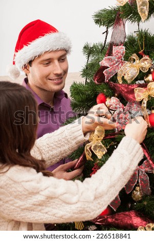 Christmas time - family decorating the Christmas tree