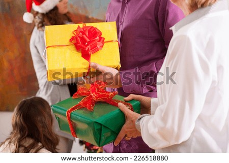Close-up of time of giving Christmas presents