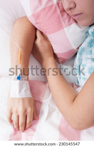 Close-up of young woman with cancer on her chemotherapy