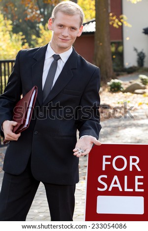 Handsome real estate broker during his work