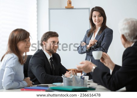 Businesspeople participating in brainstorming during business meeting