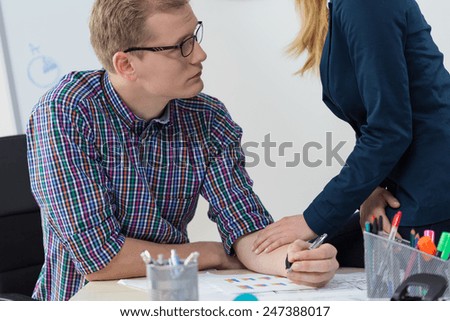 Close-up of woman supporting his worried co-worker