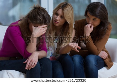 Two helpful girls talking with broke down friend