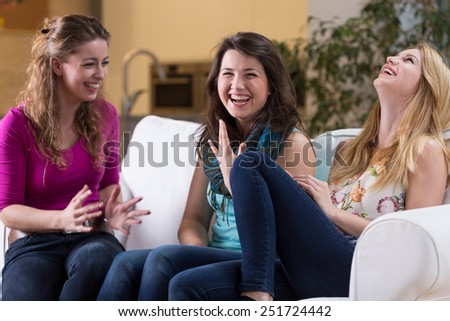 Three pretty friends laughing on meeting