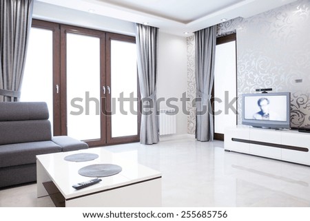 Elegant living room interior with silver wallpaper