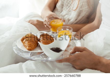 Eating breakfast in bed in lazy morning
