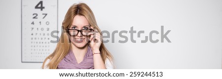 Blonde beauty woman in optician\'s office - panorama
