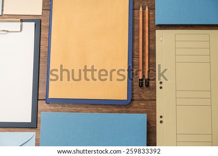 Close-up of organized office supplies on wooden desk