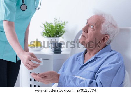 Horizontal view of retired man in hospital