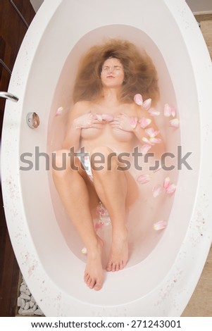 View of woman under water in the bathtub