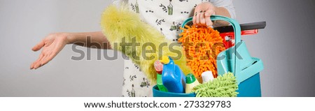 Woman preparing to clean the house with household equipment