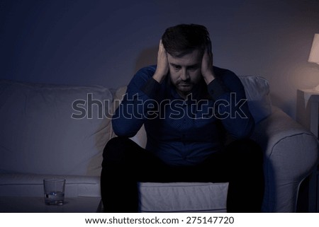 Image of worried adult man covering ears